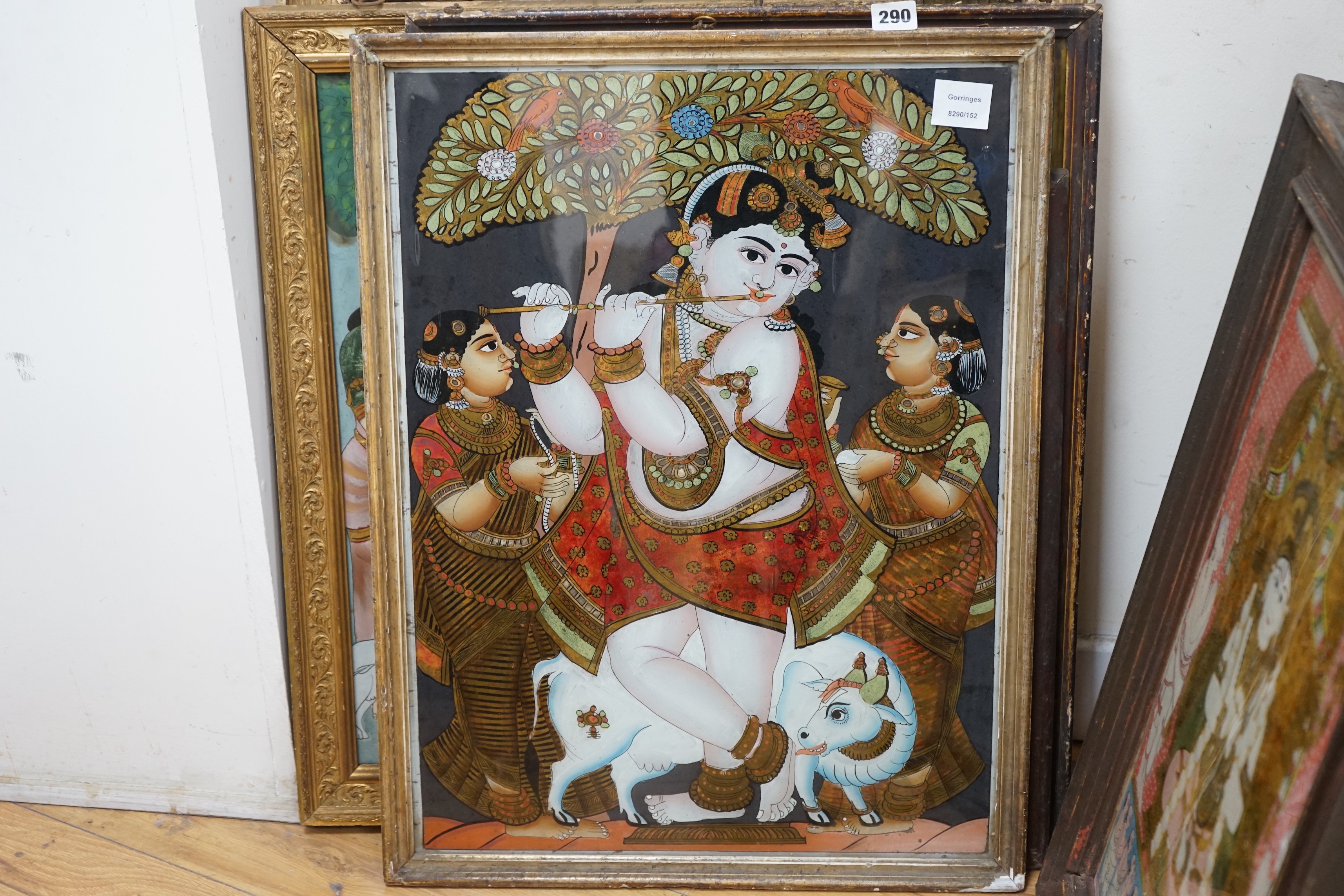 A collection of eight Indian reverse decorated glass pictures, 20th century, largest frame 70cm X 60cm